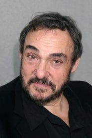 Profile picture of John Rhys-Davies who plays Desmond Wilhorn